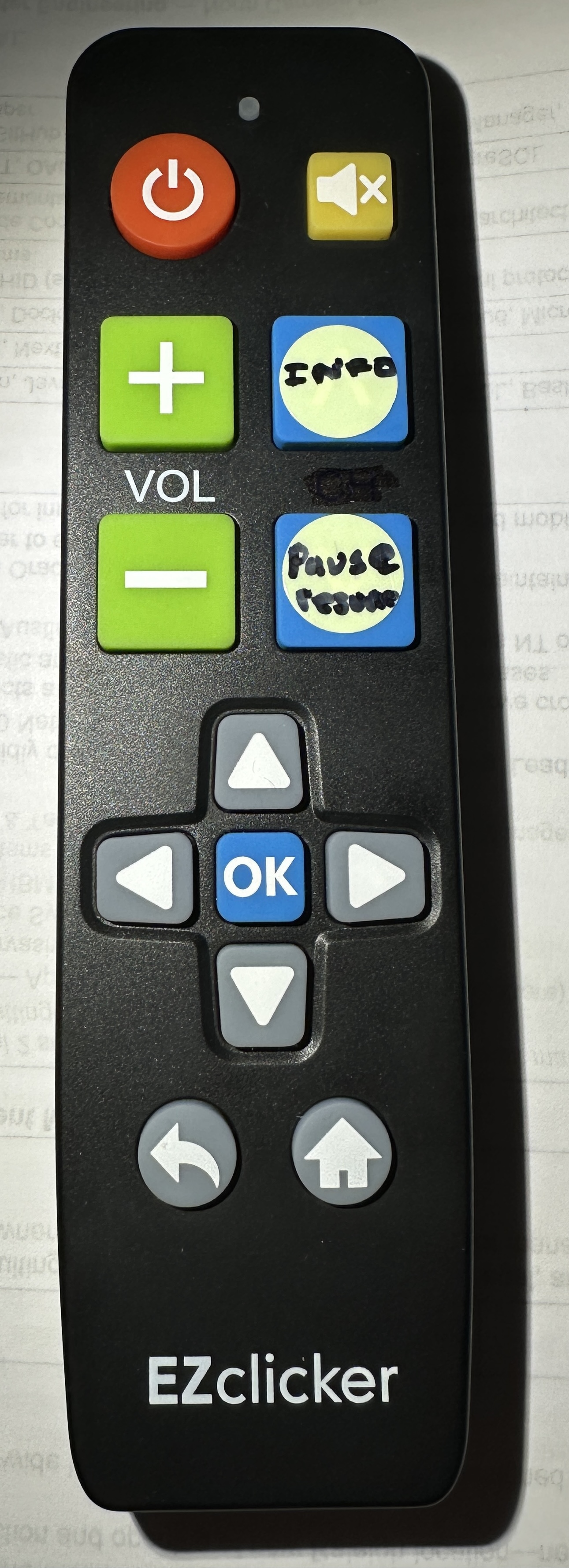Big-button universal remote with Info and Pause sticker labels
